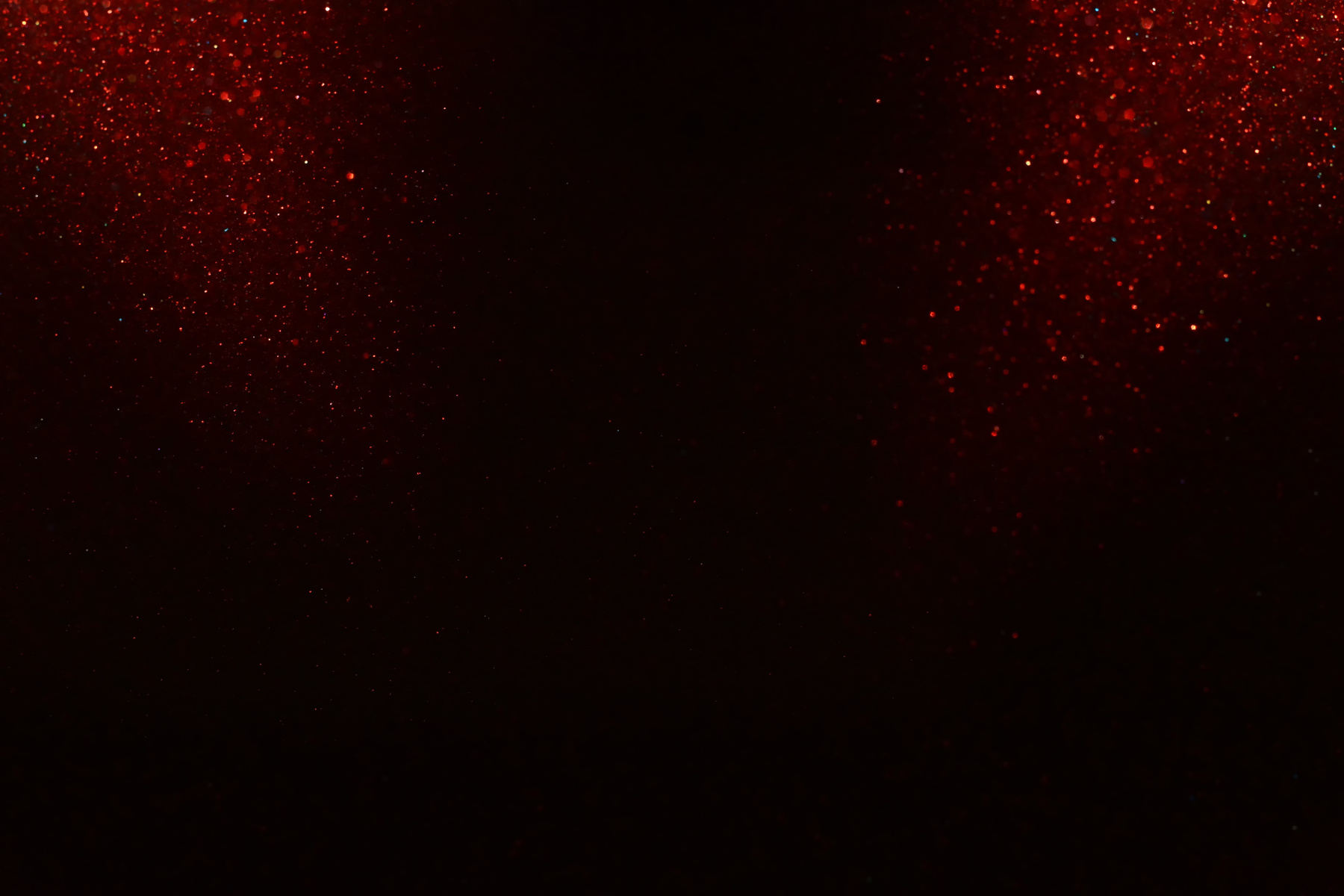 Red and black glitter vintage lights background. defocused.